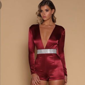 Silky burgundy romper with plunge v-neck.